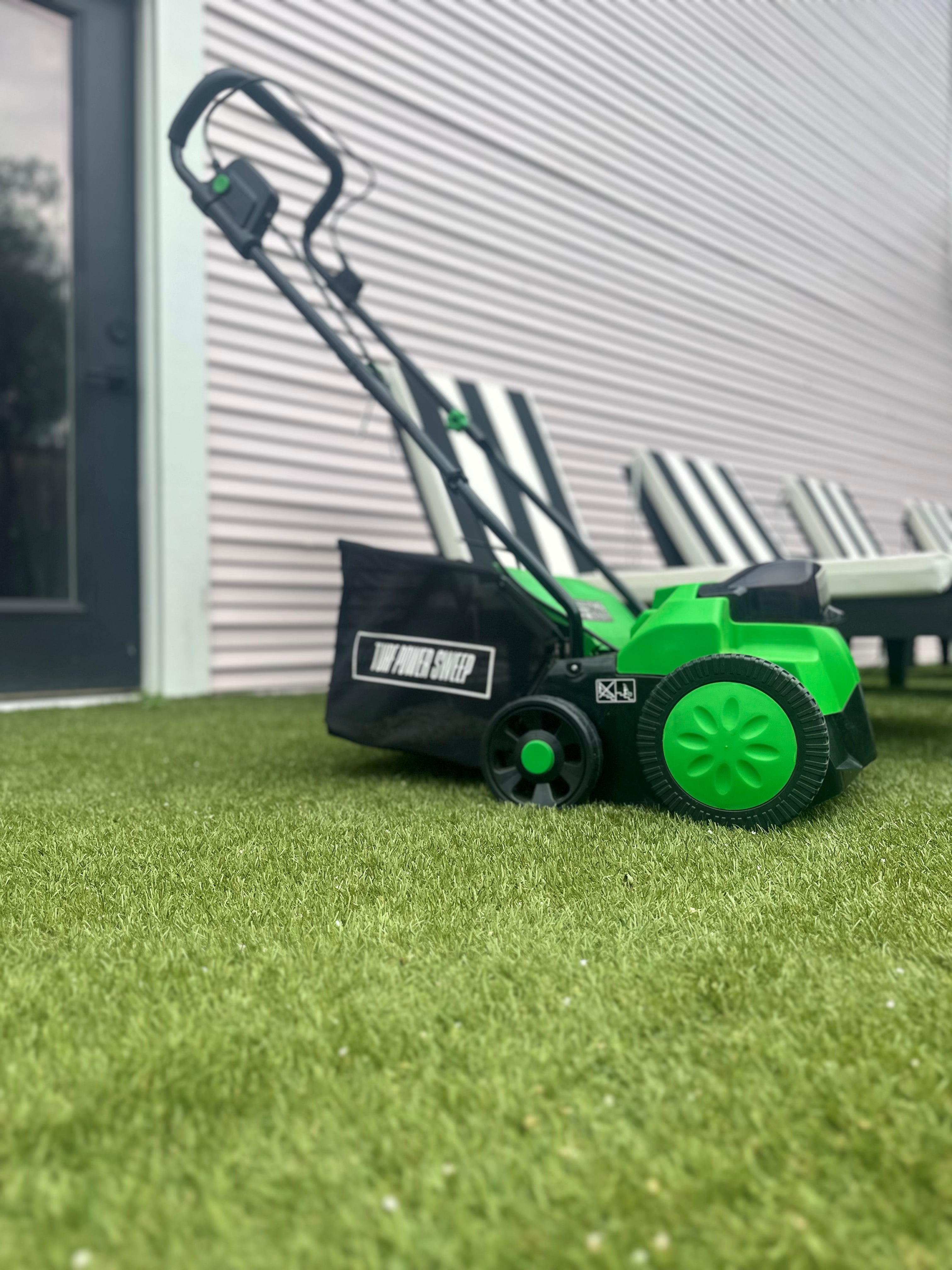 Green and Black Turf Power Sweep On Artificial Grass That Has Been Cleaned